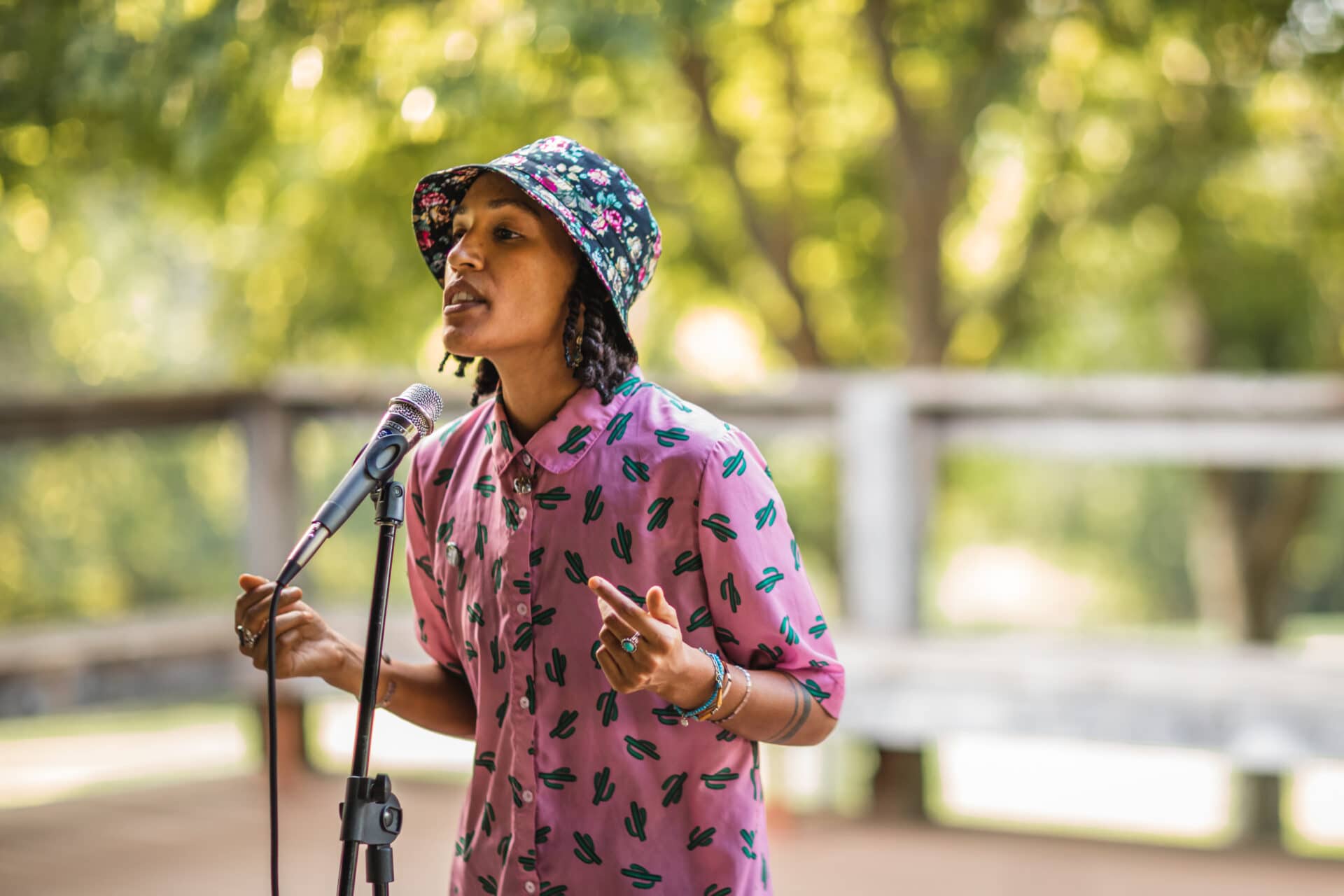 female speaking in mic on stage