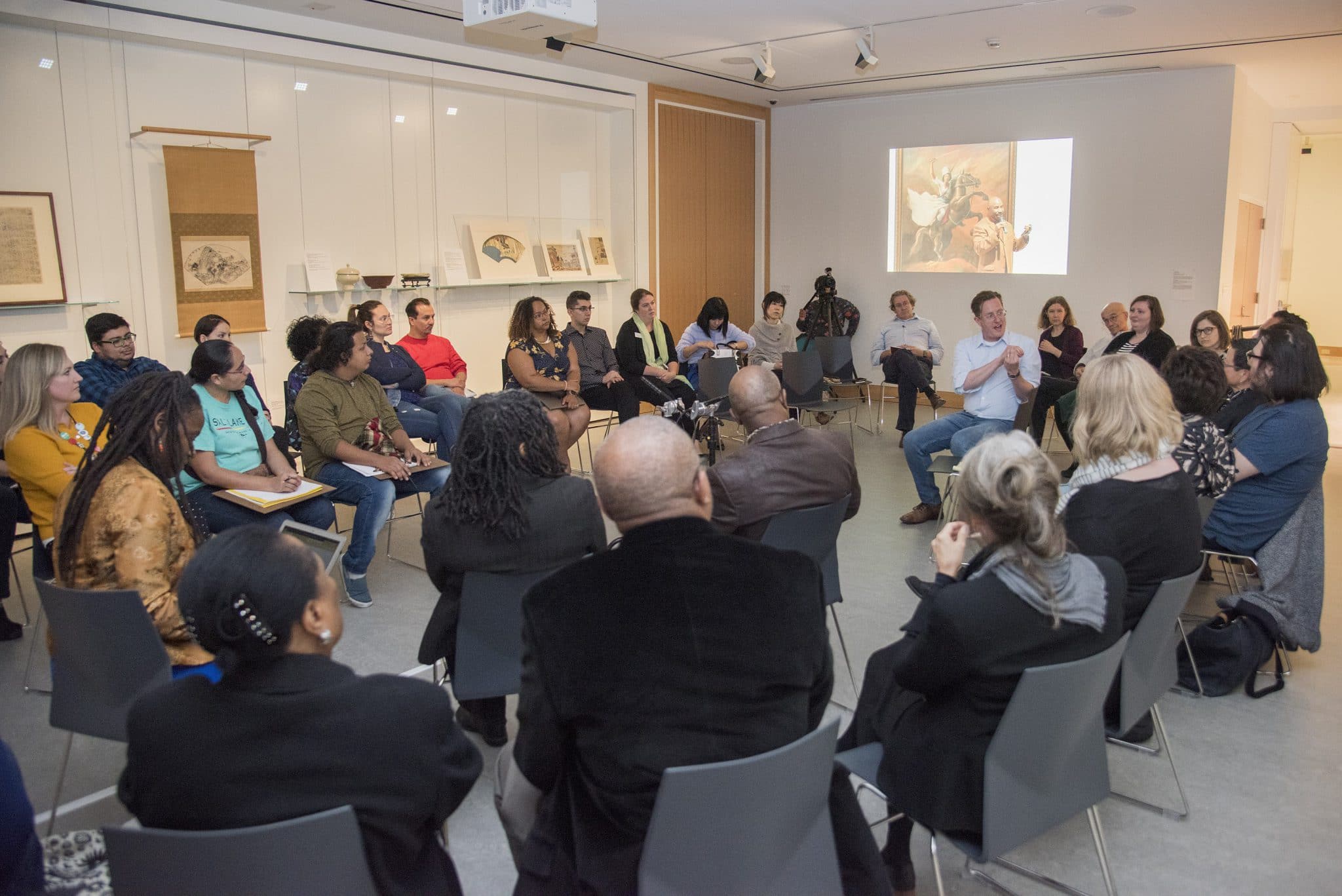 a group of people attending the presentation 