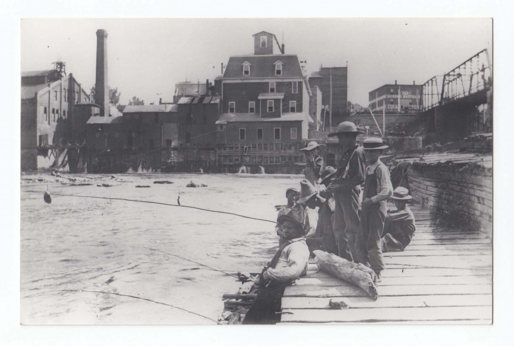 people fishing by the lake