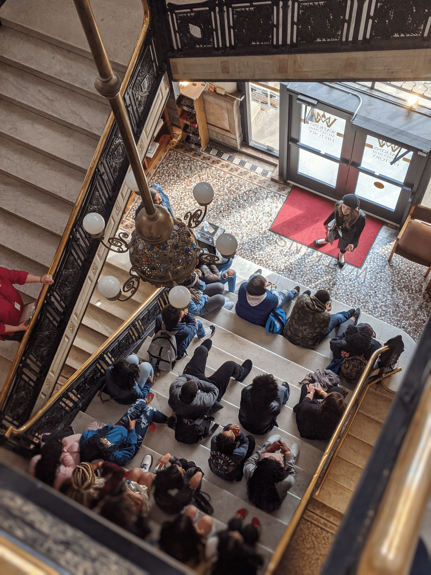 group of people sitting on stairs