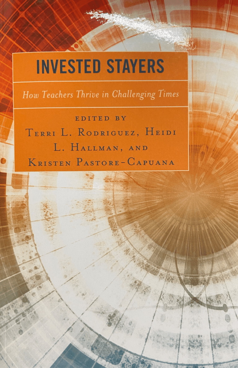 written on it as "INVESTED STAYERS" with orange print in background.