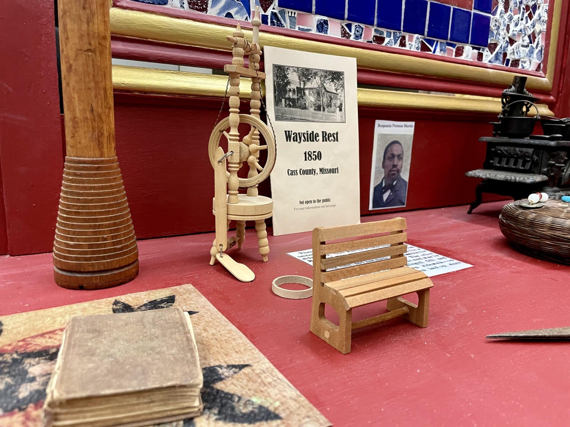 display of wooden items with a book placed alongside.