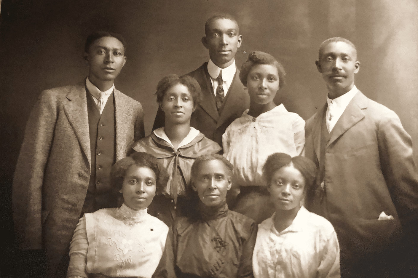 a group of people in brown colored photo