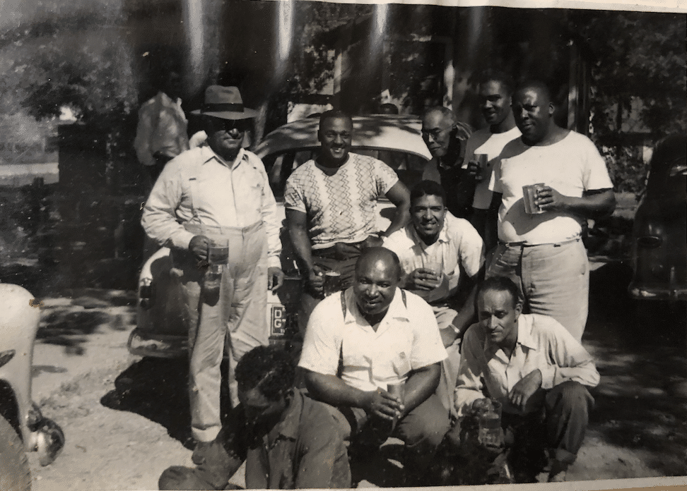 a group of people in black and white photo.