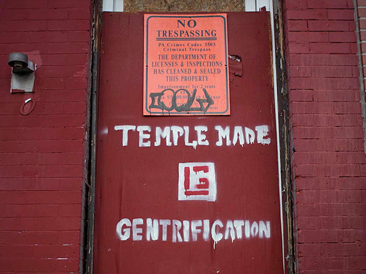 no trespassing written on red door .