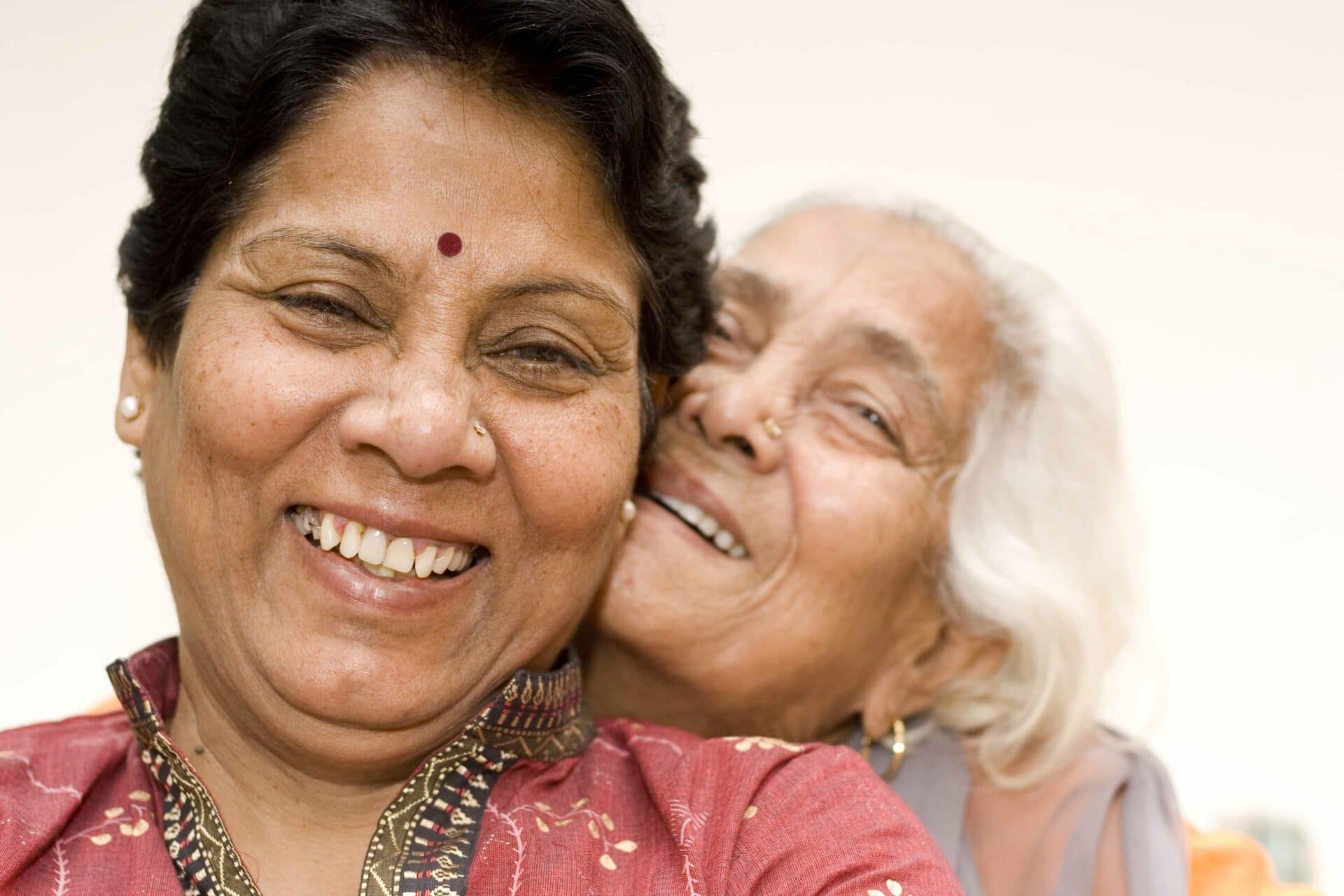 two women smiling.