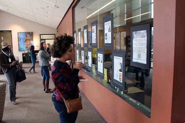 A person looking at an HBW project on a wall