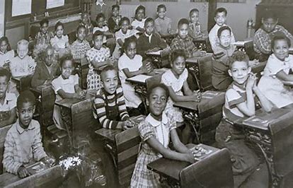 A black and white photo of students in a classroom